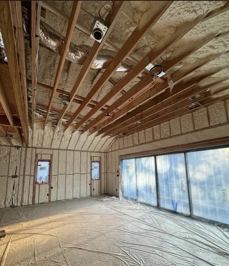 Interior walls and ceiling insulated with spray foam during new construction in Schuyler Falls